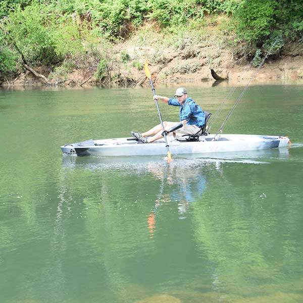 Man with prosthetic kayaking